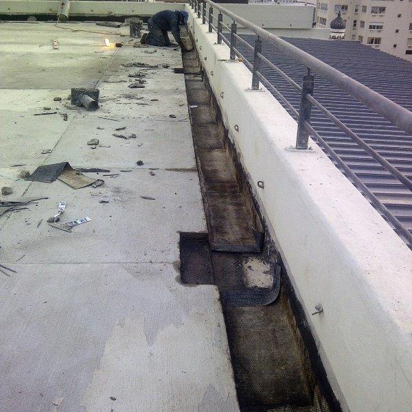 Roof
                  deck waterproofing with enhanced sidewall outlets.
                  Perimeter channel loose lay paving on support rings
                  with ballast cover